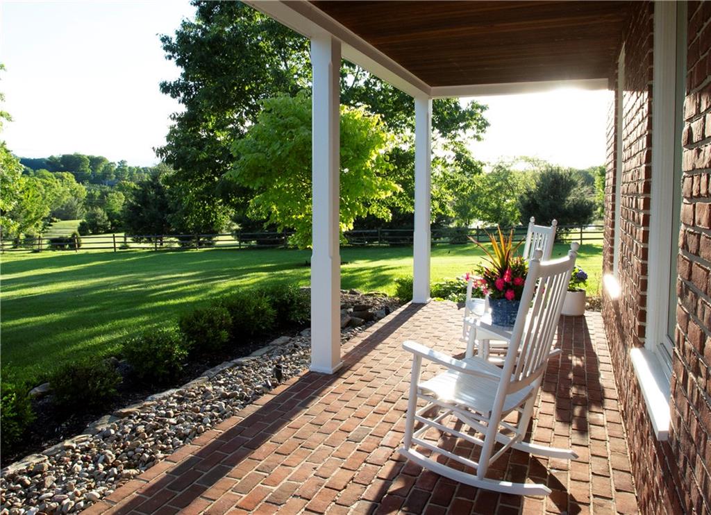 255 Camp Run Road Harmony, PA 16037 - Photo 3 of 49 a view of a porch with furniture and garden