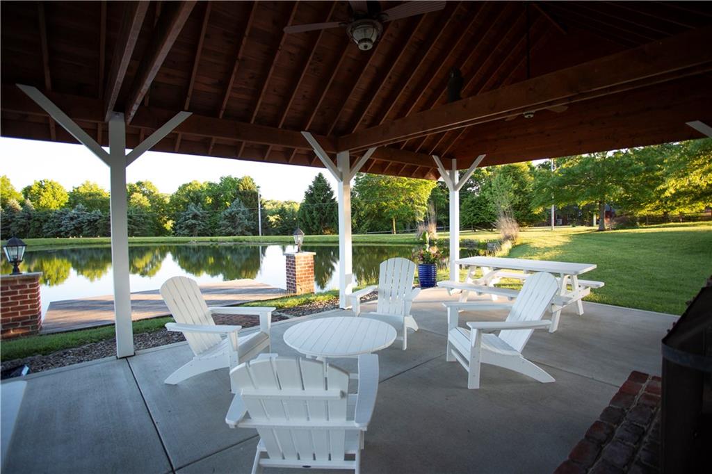 255 Camp Run Road Harmony, PA 16037 - Photo 34 of 49 a view of a patio with couches chairs and a lake view