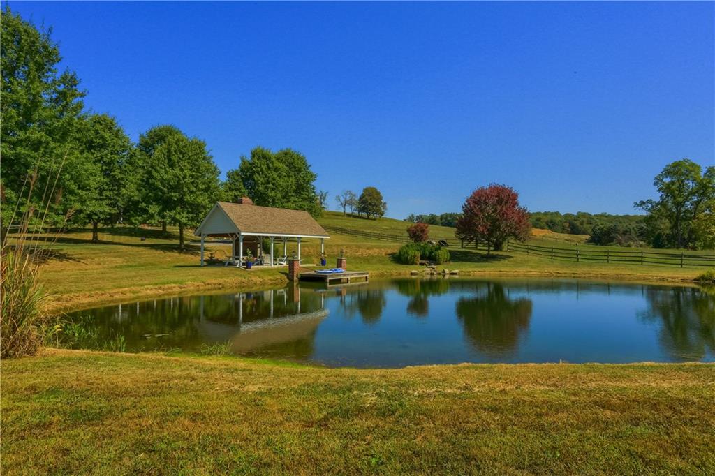 255 Camp Run Road Harmony, PA 16037 - Photo 37 of 49 a view of a lake with a house in the background