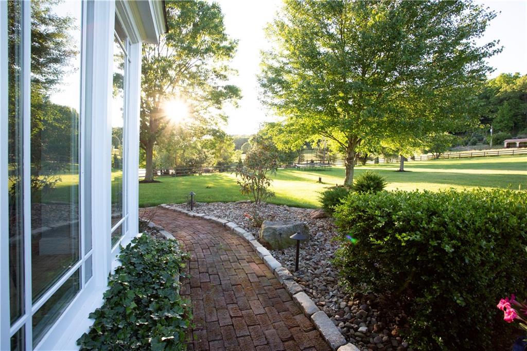 255 Camp Run Road Harmony, PA 16037 - Photo 5 of 49 a view of a yard with plants and large trees
