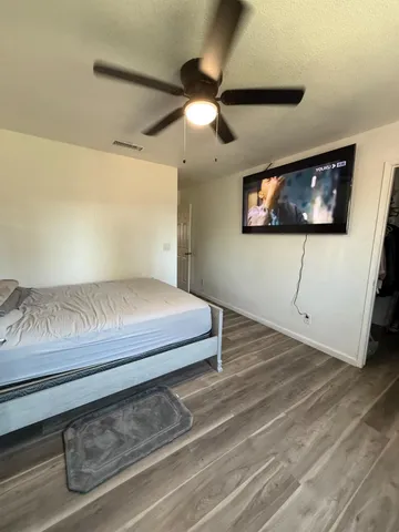 a bedroom with a bed and furniture