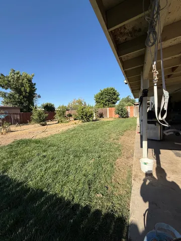 a view of a yard with an outdoor space