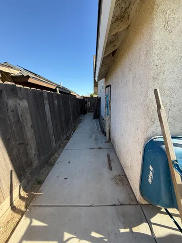 a utility room with sink dryer and washer