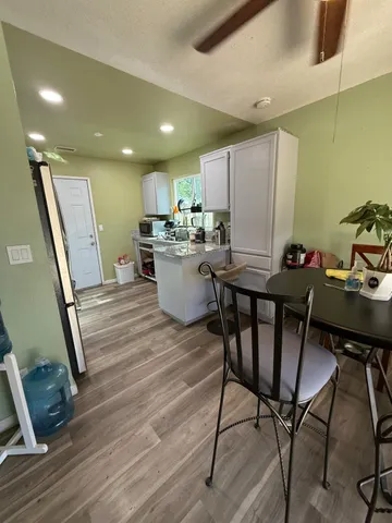 a view of entryway with wooden floor
