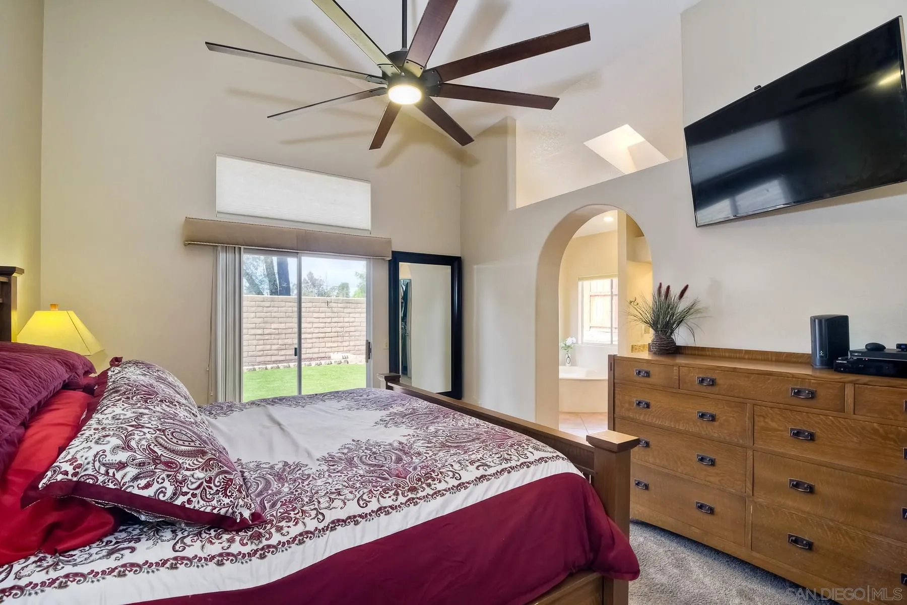 14430 Silver Heights Road Poway, CA 92064 - Photo 25 of 33 a bedroom with a large bed and a flat tv screen on dresser