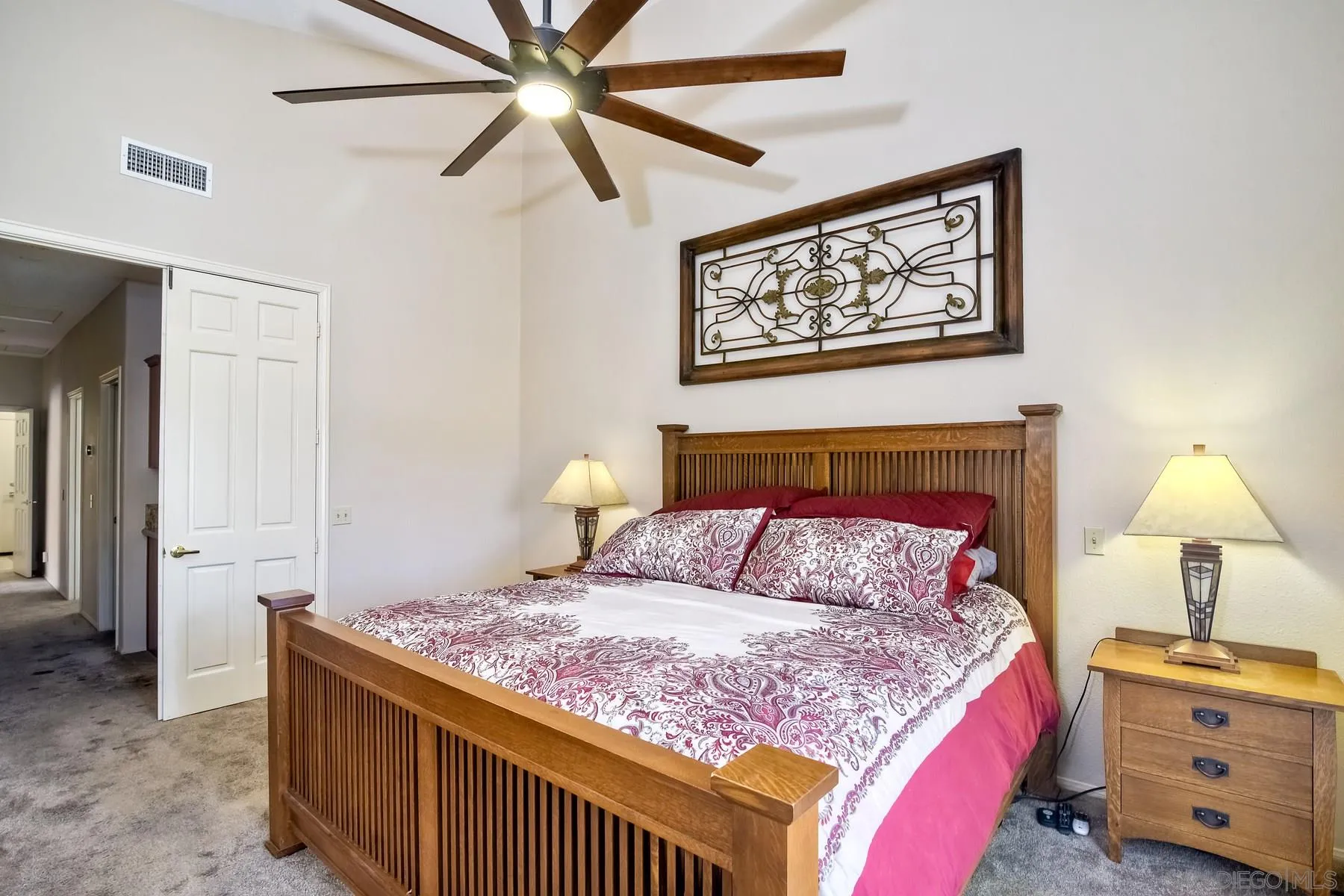 14430 Silver Heights Road Poway, CA 92064 - Photo 26 of 33 a bedroom with a bed and a lamp on the dresser