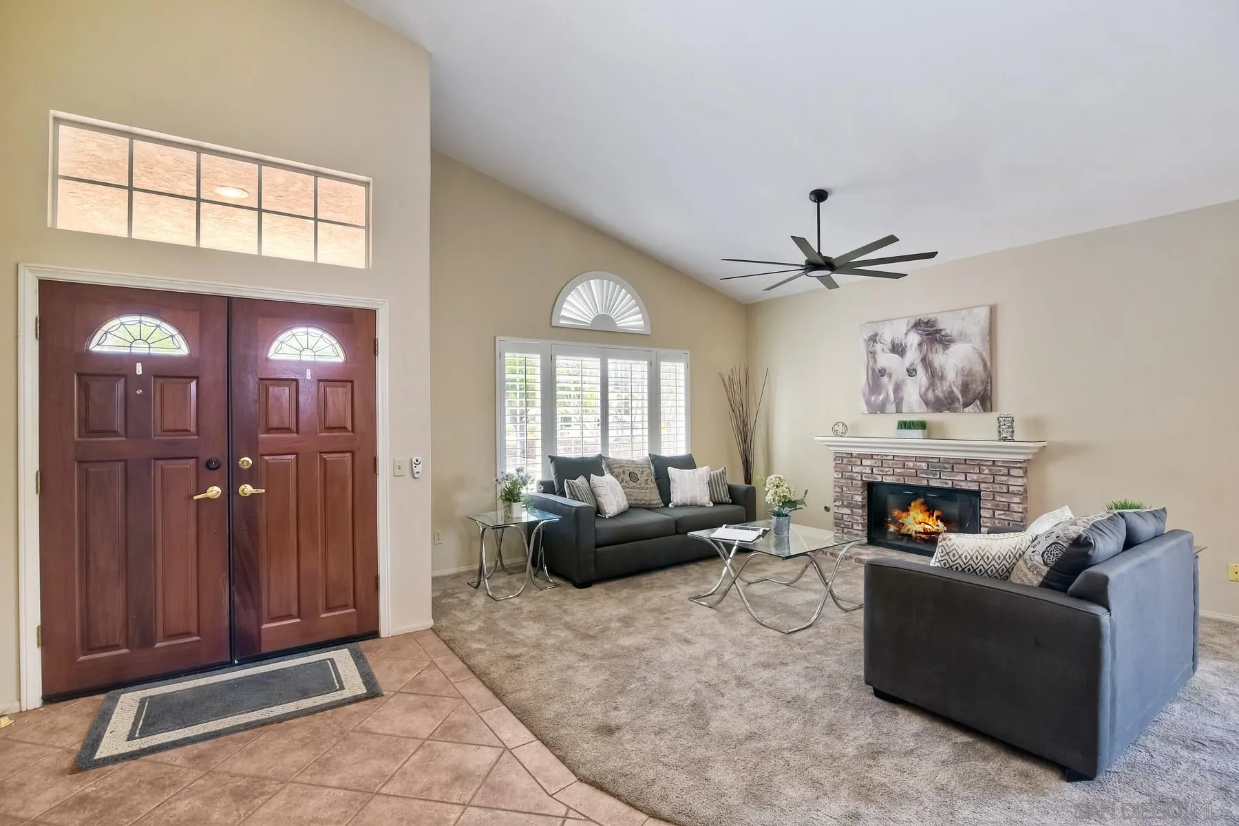 14430 Silver Heights Road Poway, CA 92064 - Photo 6 of 33 a living room with furniture a fireplace and a chandelier
