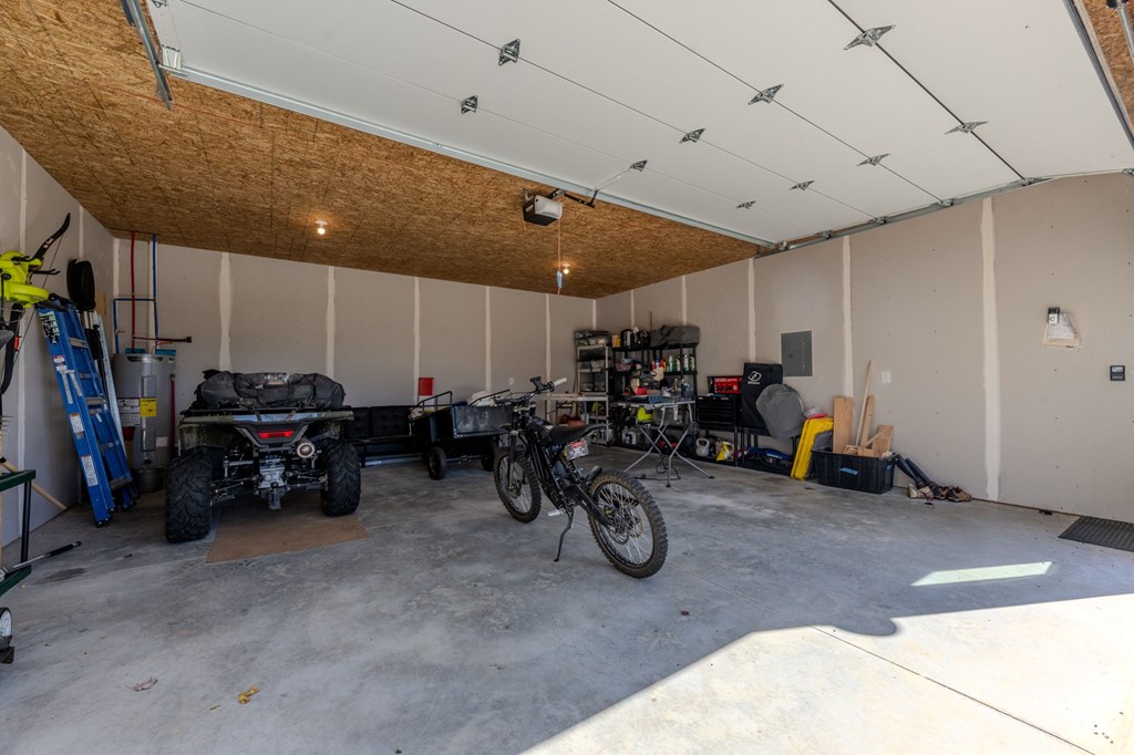 3160 Morrow Road Murphy, NC 28906 - Photo 32 of 44 a view of a garage with a bike and white car