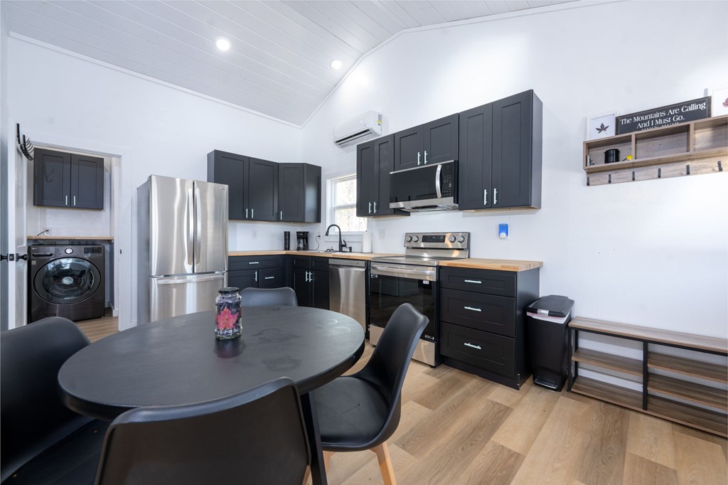 3160 Morrow Road Murphy, NC 28906 - Photo 35 of 44 a kitchen with stainless steel appliances a dining table and chairs