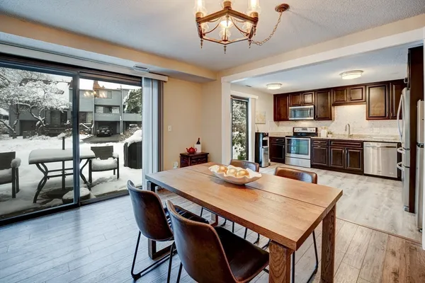 a view of a dining room with furniture window and wooden floor