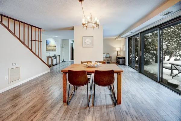 a view of a dining room with furniture window and wooden floor