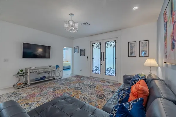 a kitchen with stainless steel appliances granite countertop a sink a stove and a refrigerator