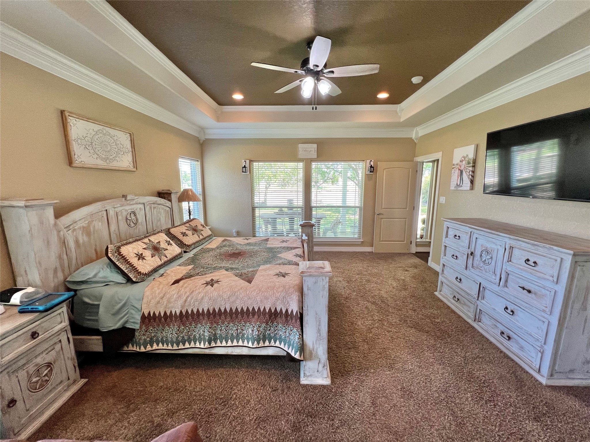 4916 County Road 819 Brazoria, TX 77422 - Photo 18 of 49 a bedroom with a large bed and a tv