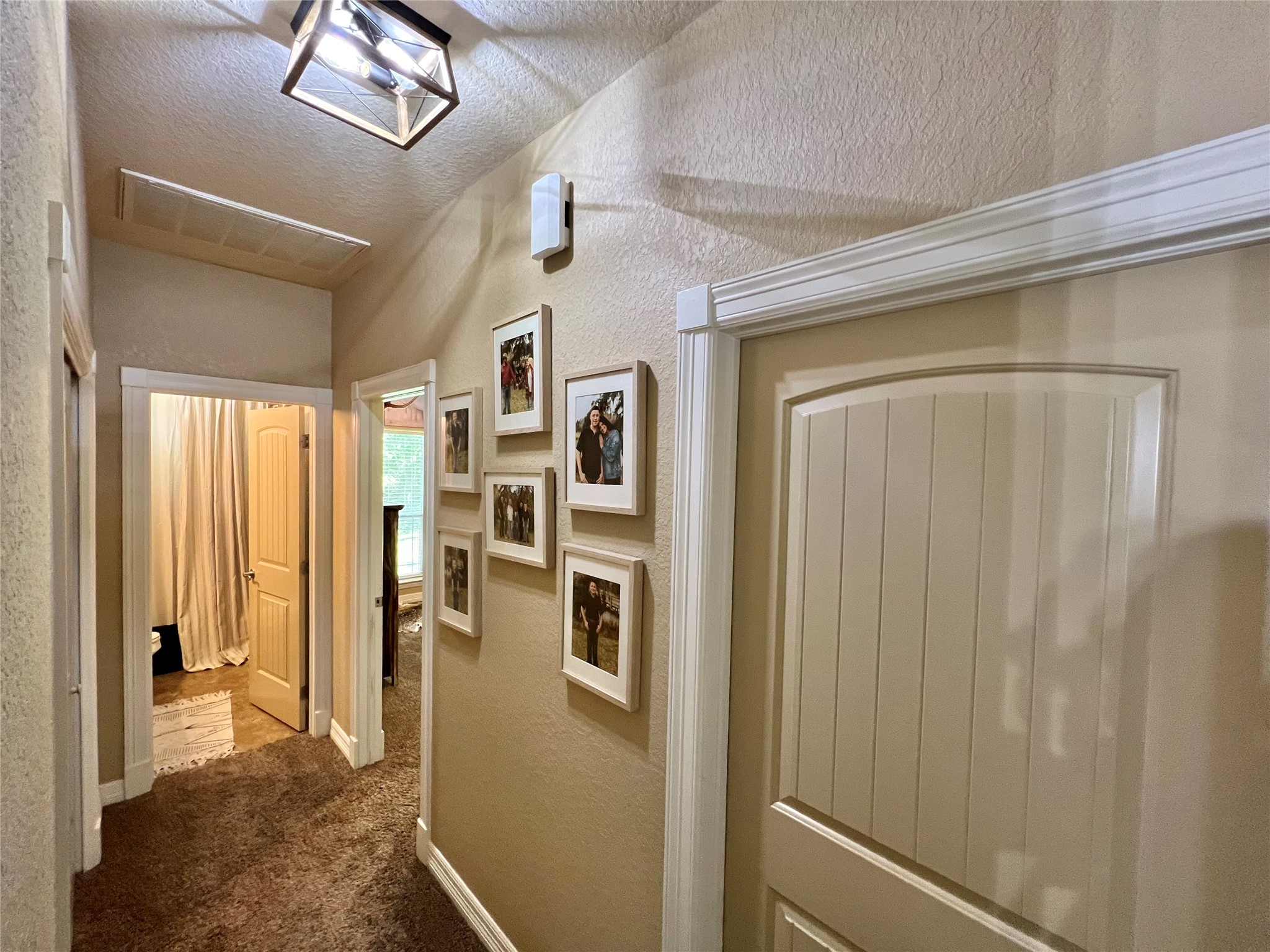 4916 County Road 819 Brazoria, TX 77422 - Photo 23 of 49 a view of a hallway with a chandelier