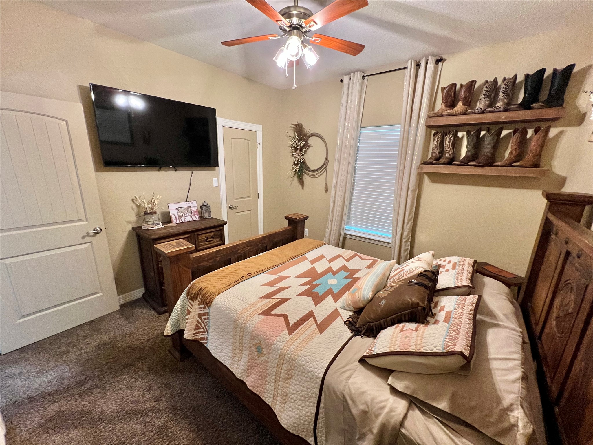 4916 County Road 819 Brazoria, TX 77422 - Photo 25 of 49 a bedroom with a bed and a flat screen tv