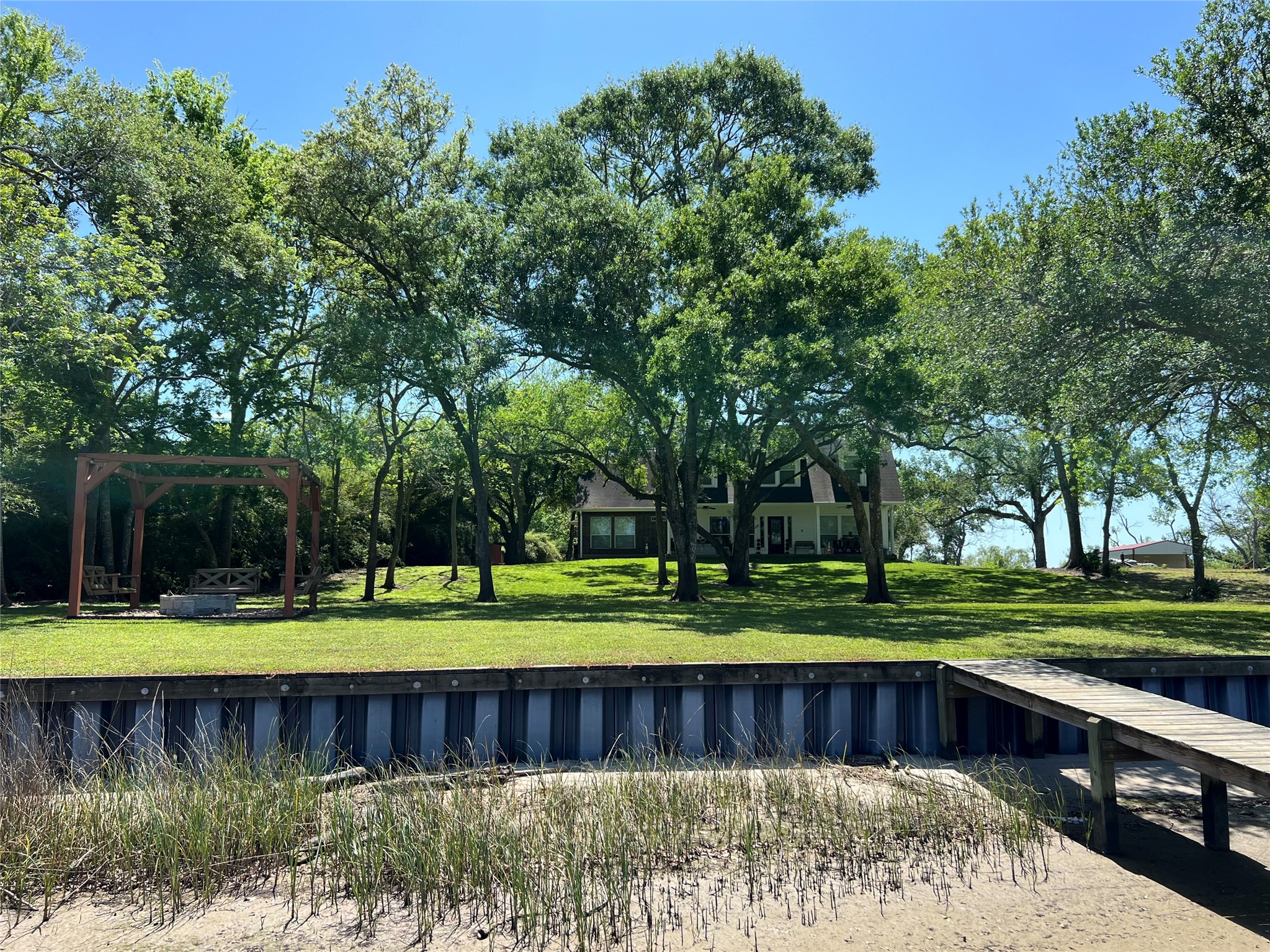 4916 County Road 819 Brazoria, TX 77422 - Photo 47 of 49 a view of a yard with large tree and wooden fence