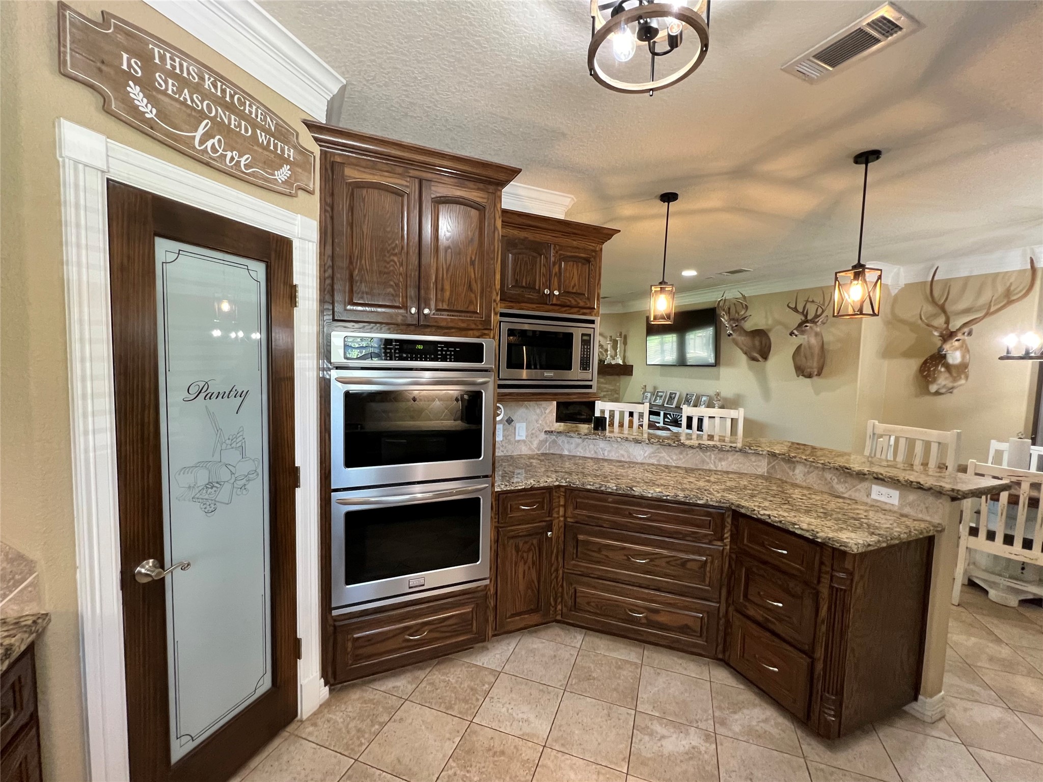 4916 County Road 819 Brazoria, TX 77422 - Photo 8 of 49 a kitchen with stainless steel appliances granite countertop a sink and cabinets