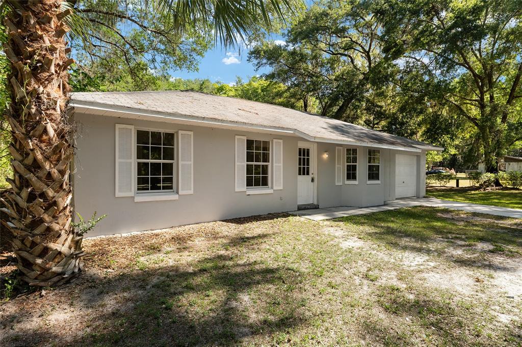 4329 Northwest 155th Street Reddick, FL 32686 - Photo 7 of 52 a backyard of a house