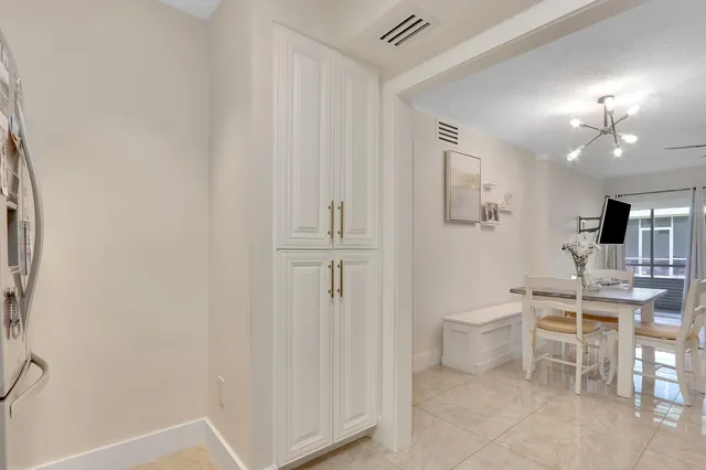 a view of a hallway with seating area