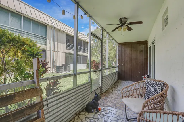 a view of balcony with a potted plant