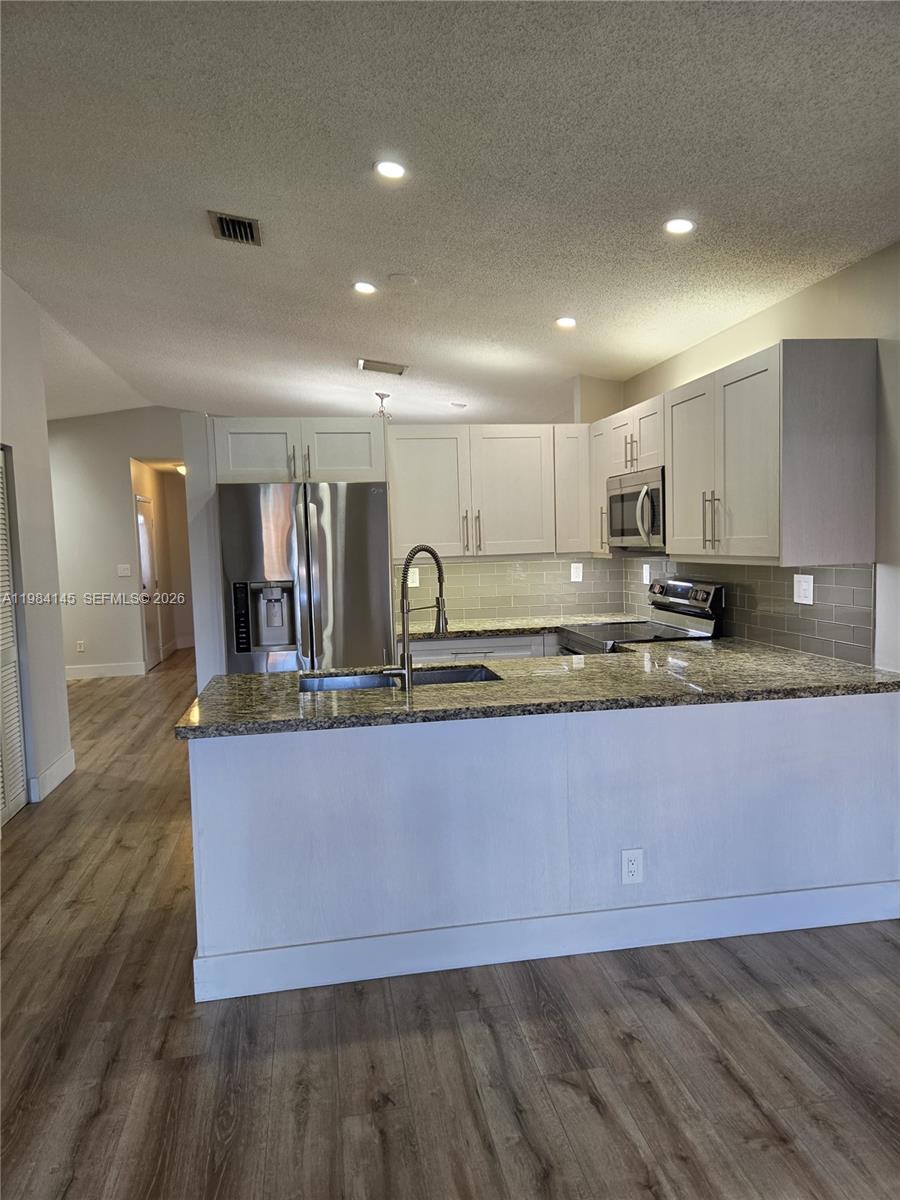 14365 Southwest 175th Terrace Miami, FL 33177 - Photo 19 of 31 a view of kitchen with granite countertop window