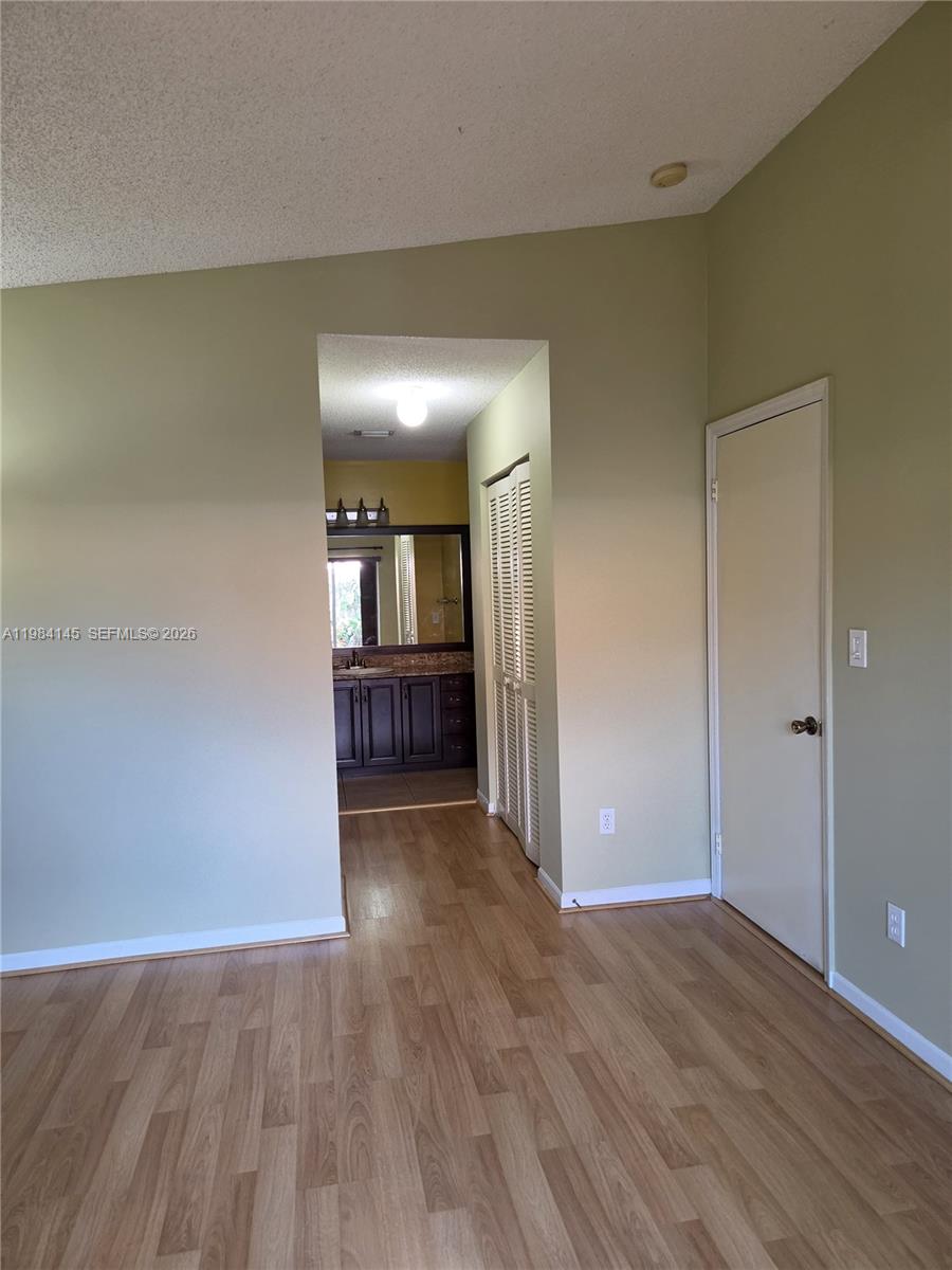 14365 Southwest 175th Terrace Miami, FL 33177 - Photo 20 of 31 wooden floor in an empty room