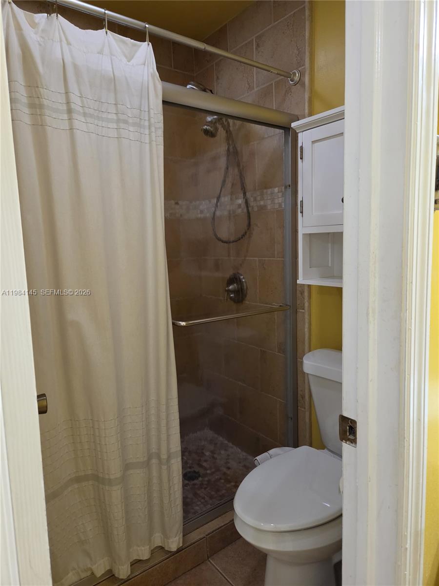 14365 Southwest 175th Terrace Miami, FL 33177 - Photo 23 of 31 a bathroom with a toilet and a shower