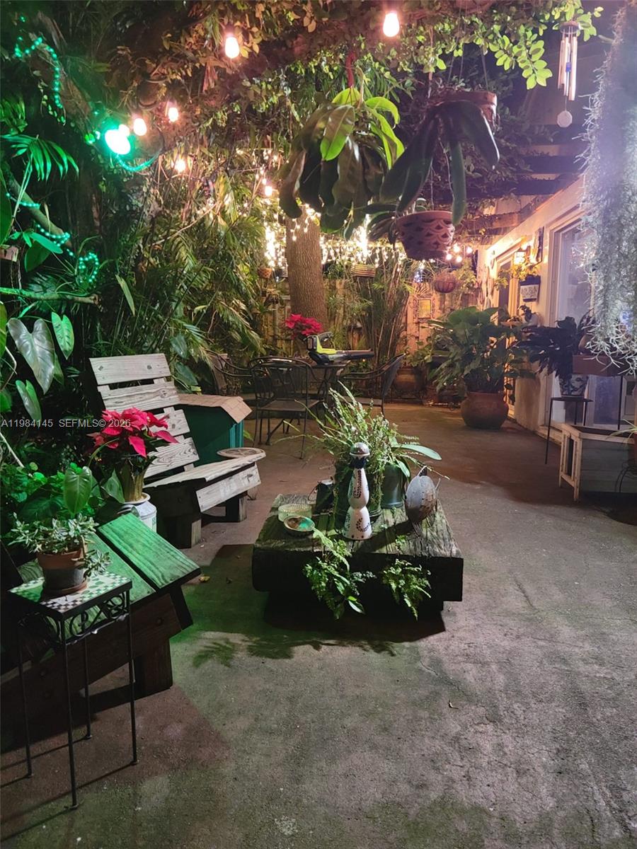 14365 Southwest 175th Terrace Miami, FL 33177 - Photo 28 of 31 a backyard with furniture and a potted plant