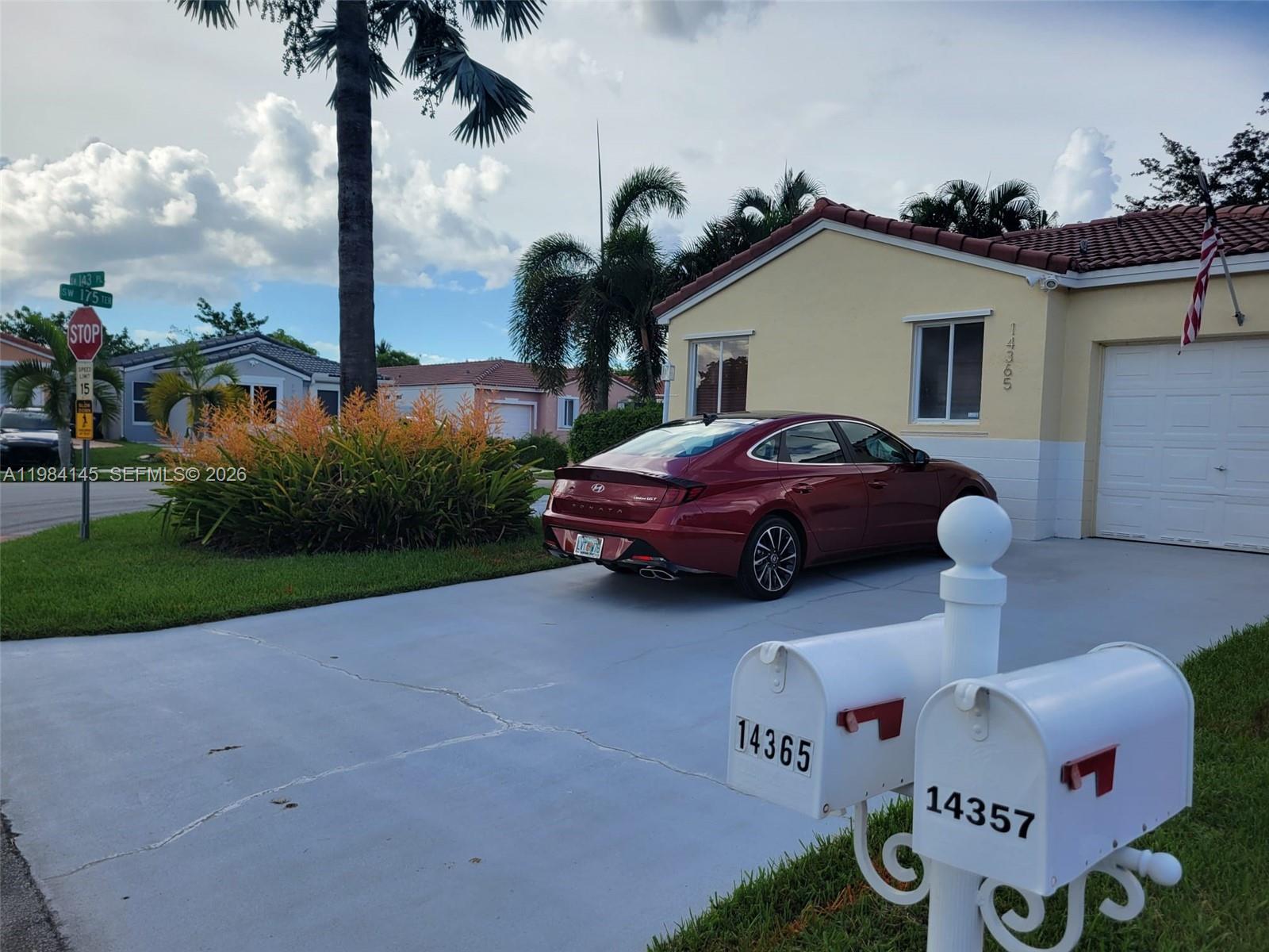 14365 Southwest 175th Terrace Miami, FL 33177 - Photo 30 of 31 a front view of a house with garden