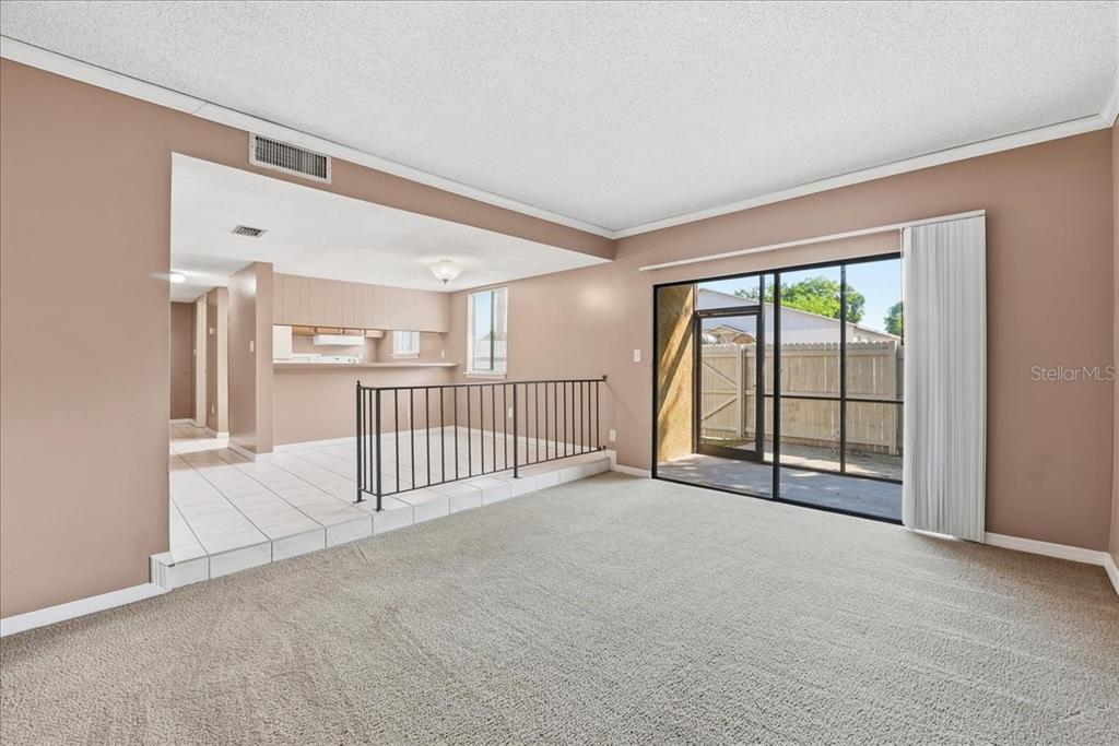 1428 Oak Place, Unit C Apopka, FL 32712 - Photo 3 of 16 a view of an empty room with a window