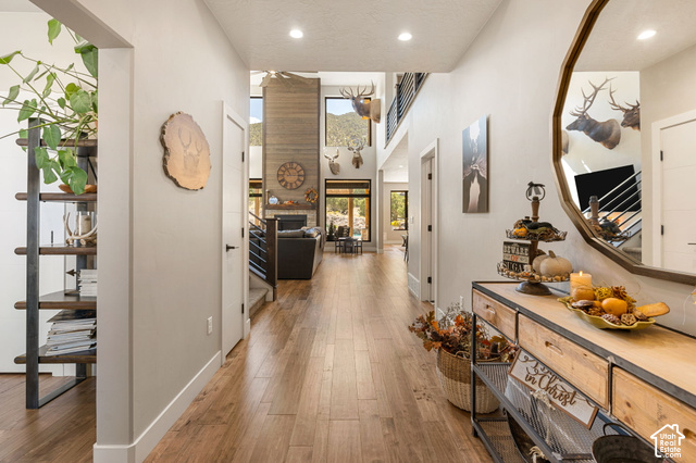 1192 East Ashdown Road Cedar City, UT 84721 - Photo 24 of 96 Wood-finish flooring throughout, recessed lighting, and a prominent floor-to-ceiling accent wall