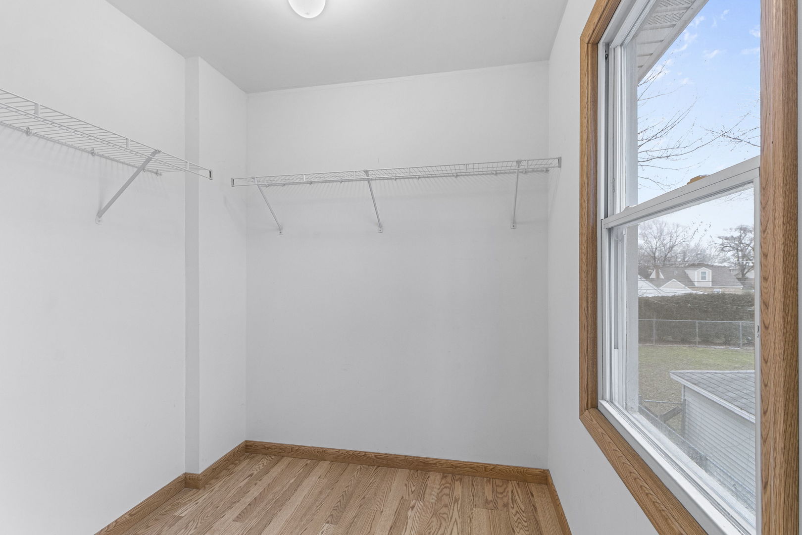 6837 Roberts Road Bridgeview, IL 60455 - Photo 18 of 22 a view of a room with wooden floor and fan