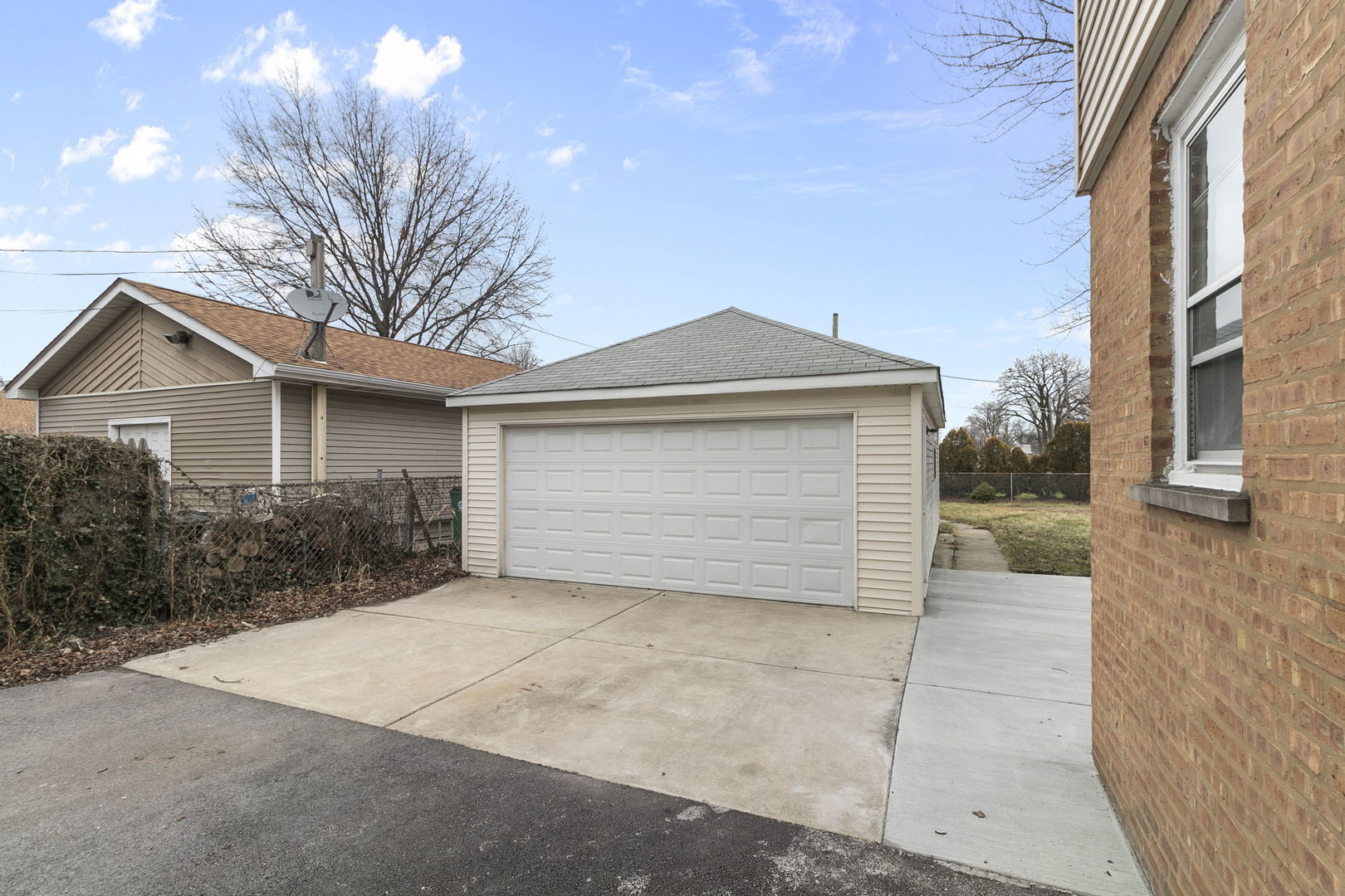 6837 Roberts Road Bridgeview, IL 60455 - Photo 22 of 22 a front view of a house with a yard and garage