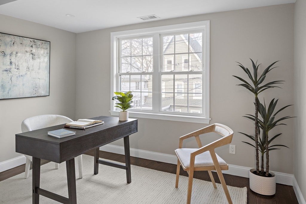 12 Madison Street, Unit 2 Somerville, MA 02143 - Photo 10 of 24 a workspace with furniture and a potted plant