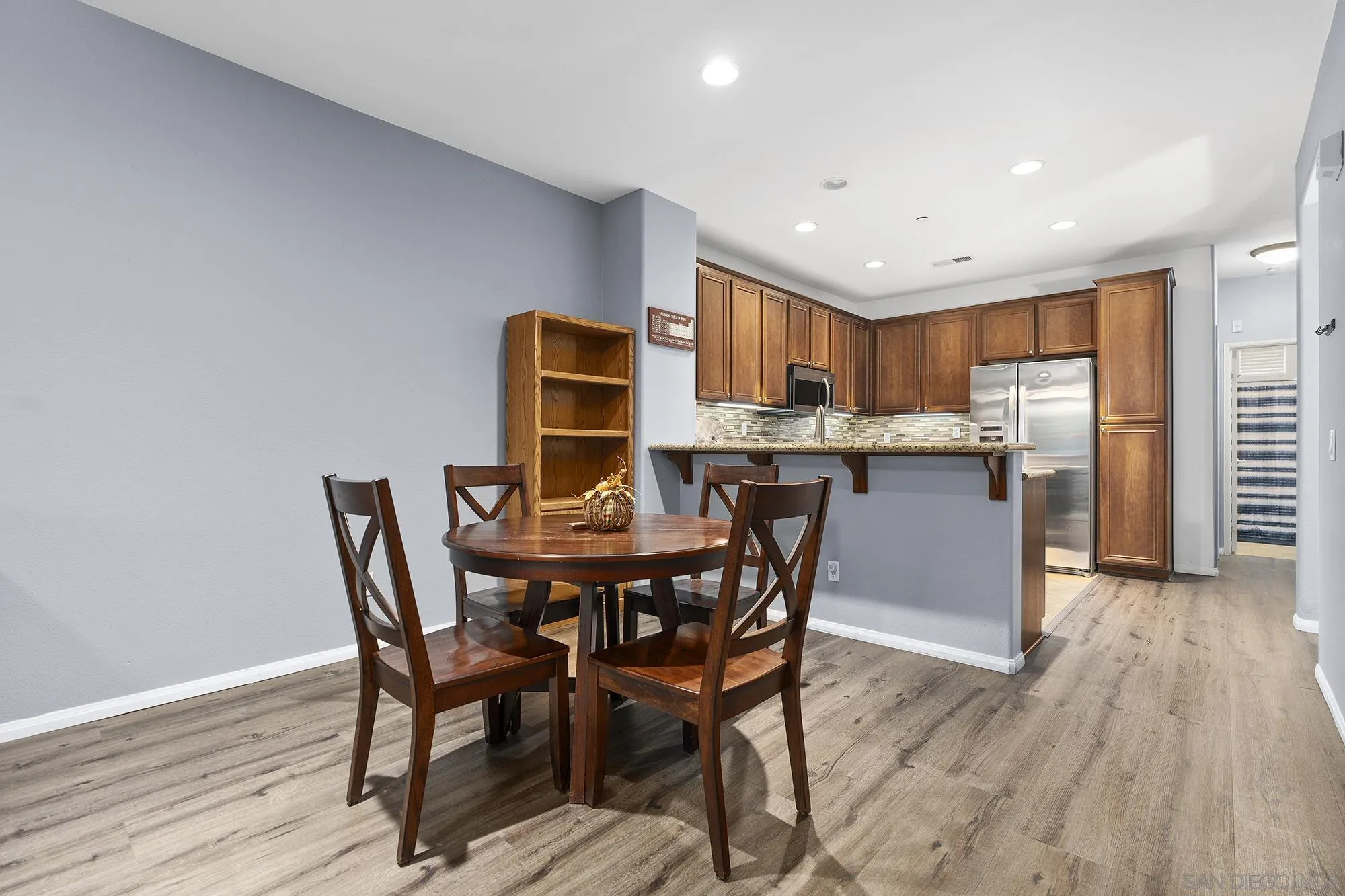 156 Via Montisi Santee, CA 92071 - Photo 11 of 25 a view of a dining room with furniture and wooden floor