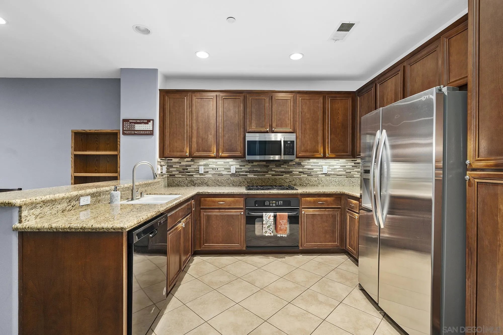 156 Via Montisi Santee, CA 92071 - Photo 12 of 25 a kitchen with stainless steel appliances granite countertop a refrigerator sink and stove