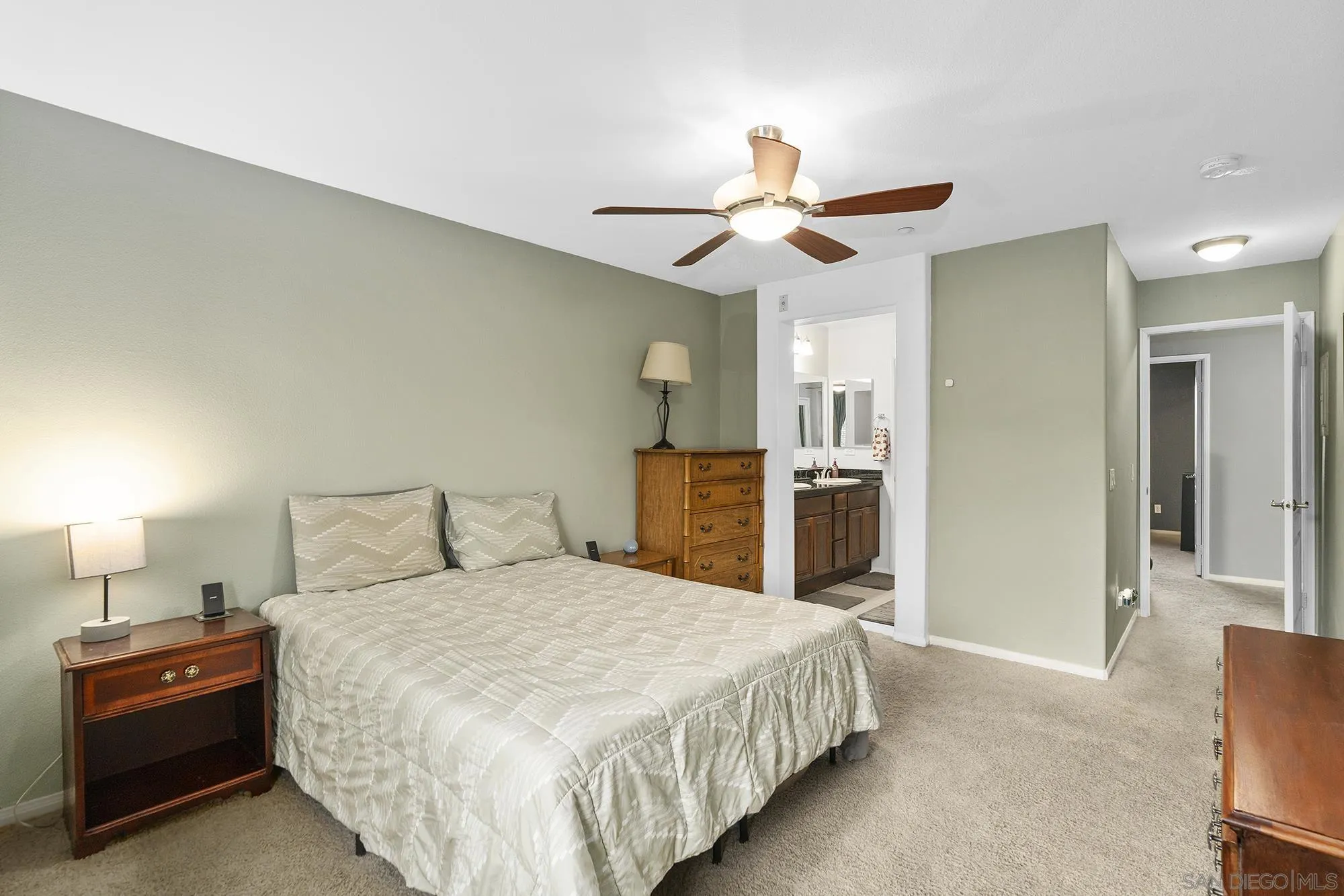 156 Via Montisi Santee, CA 92071 - Photo 21 of 25 a bedroom with a bed and a chandelier