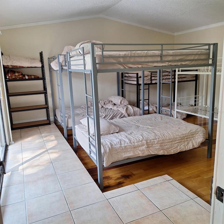 10012 Lake Louisa Road Clermont, FL 34711 - Photo 11 of 25 a bedroom with a bed and a walk in closet