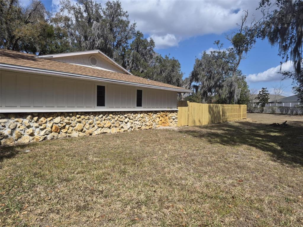 10012 Lake Louisa Road Clermont, FL 34711 - Photo 14 of 25 a view of a house with a yard