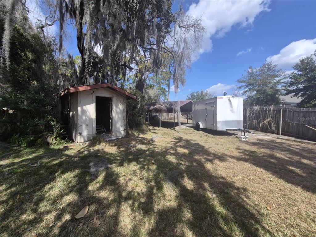 10012 Lake Louisa Road Clermont, FL 34711 - Photo 23 of 25 a view of a house with a yard