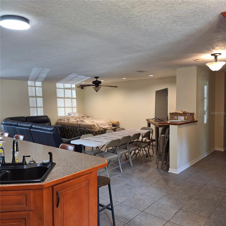10012 Lake Louisa Road Clermont, FL 34711 - Photo 5 of 25 a kitchen with a table and chairs in it
