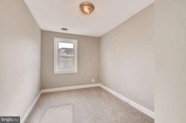 4621 Rokeby Road Baltimore, MD 21229 - Photo 15 of 28 an empty room with a window