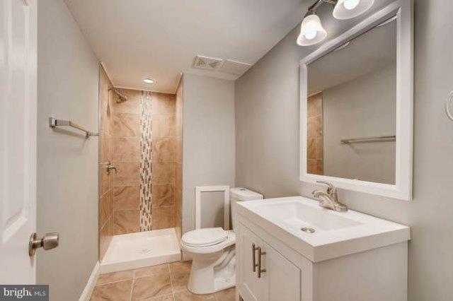 4621 Rokeby Road Baltimore, MD 21229 - Photo 24 of 28 a bathroom with a sink toilet and shower