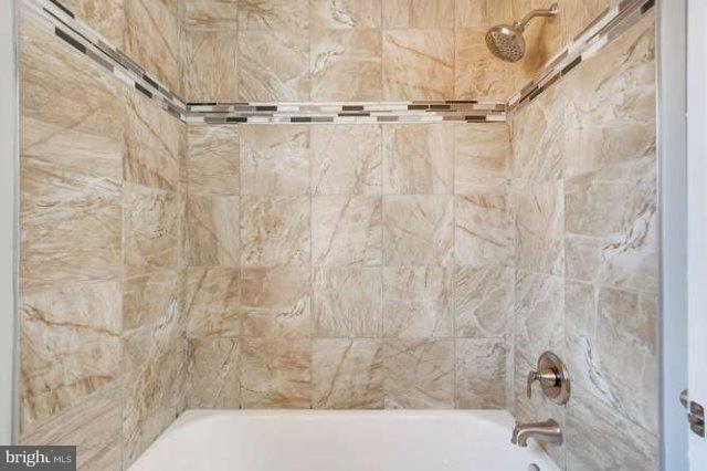 4621 Rokeby Road Baltimore, MD 21229 - Photo 25 of 28 a bathroom with a shower