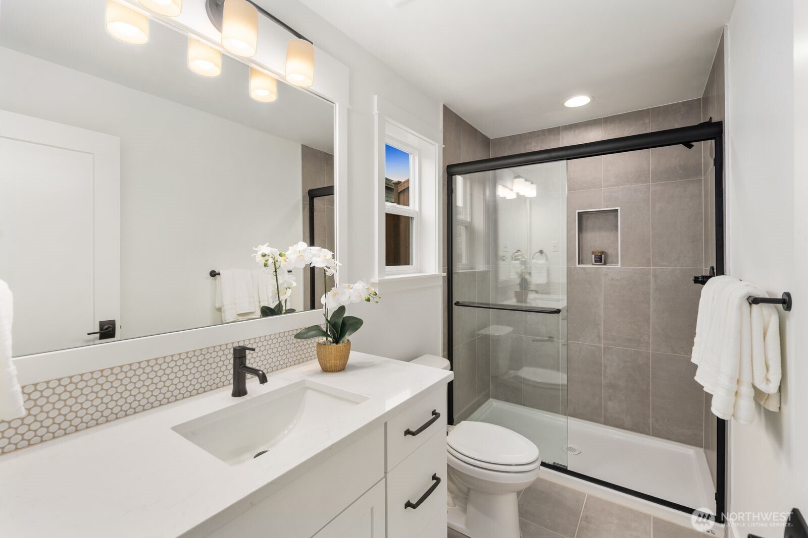 4123 220th Place Southeast Bothell, WA 98021 - Photo 14 of 25 a bathroom with a sink toilet and shower