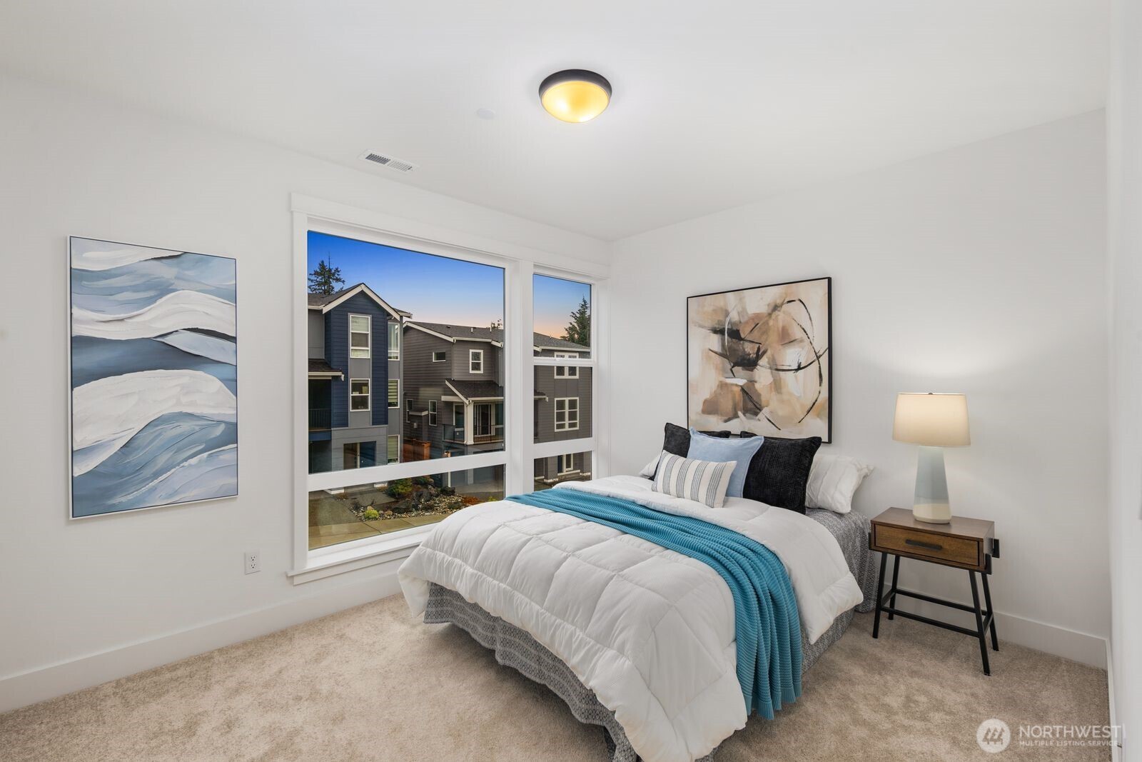 4123 220th Place Southeast Bothell, WA 98021 - Photo 15 of 25 a bedroom with a bed and a painting on the wall