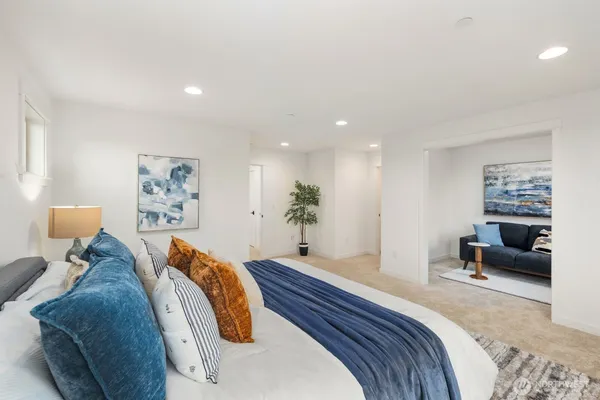 a bedroom with bed and furniture