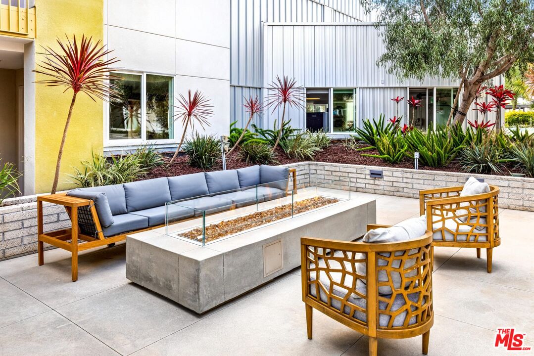 12760 Millennium Drive, Unit NB107 Los Angeles, CA 90094 - Photo 20 of 38 a building outdoor space with patio furniture