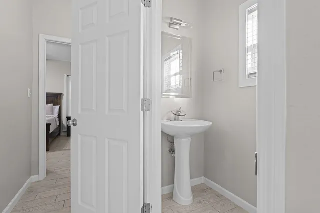 a bathroom with a sink and mirror