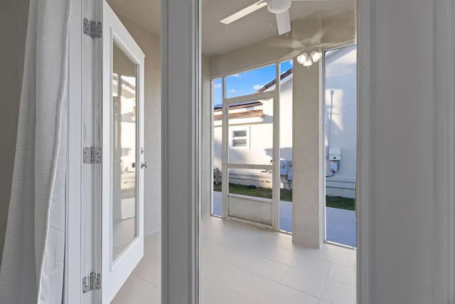 a view of an empty room and glass door